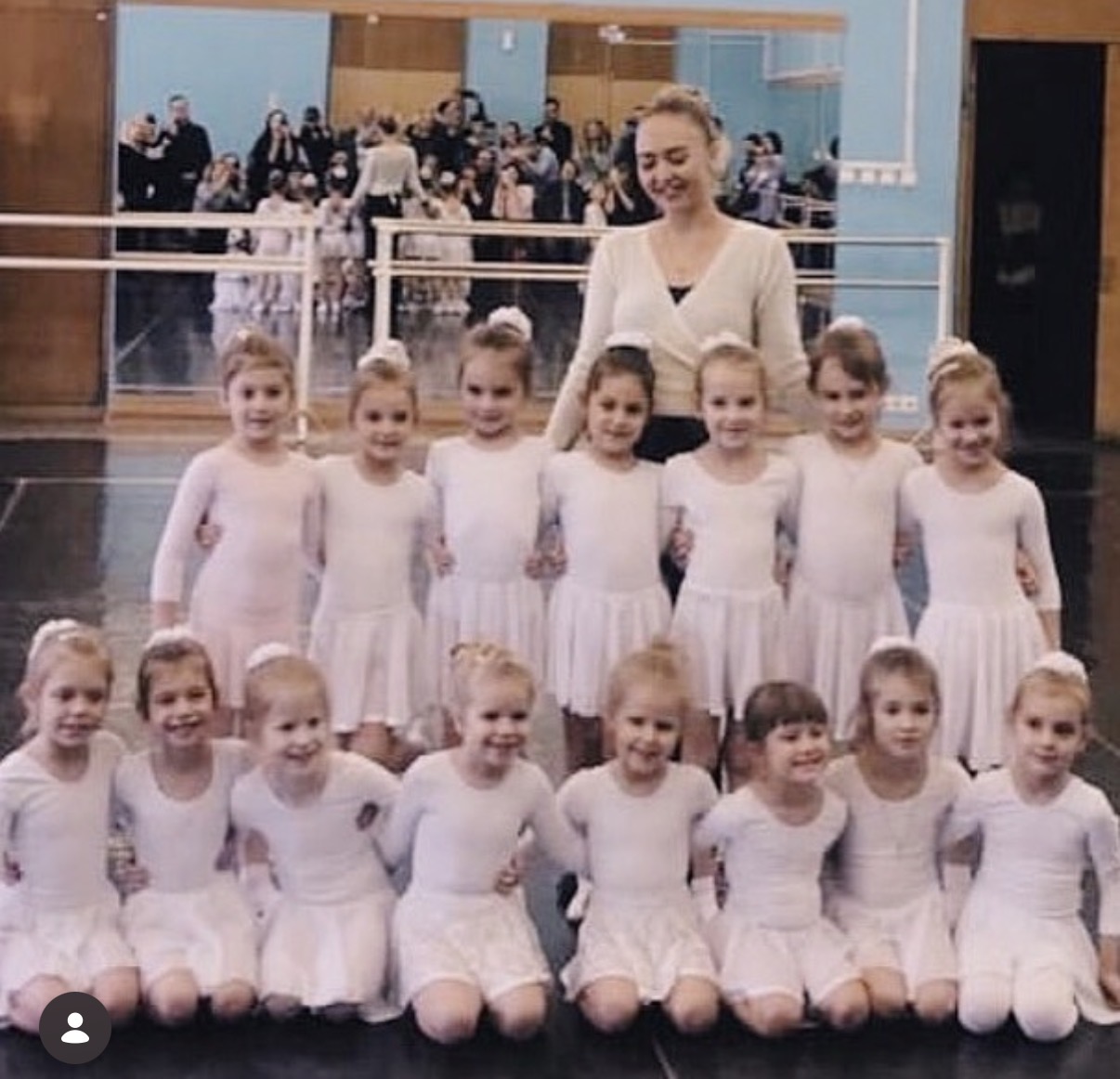 Tatiana Samoshkina with her ballet class in white leotards at the Moskvich Cultural Centre in Moscow