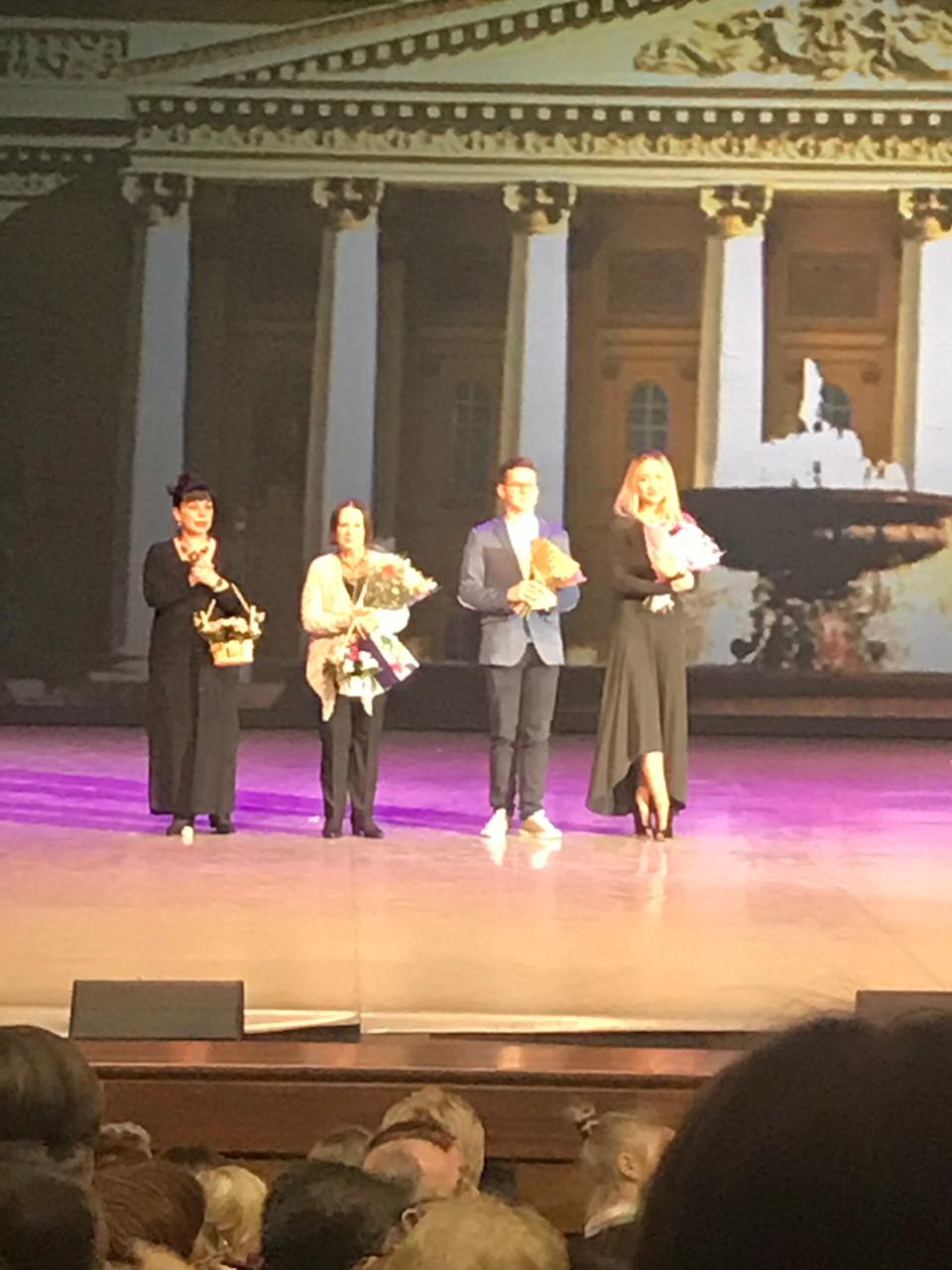 Tatiana Samoshkina on stage during a curtain call with fellow artists