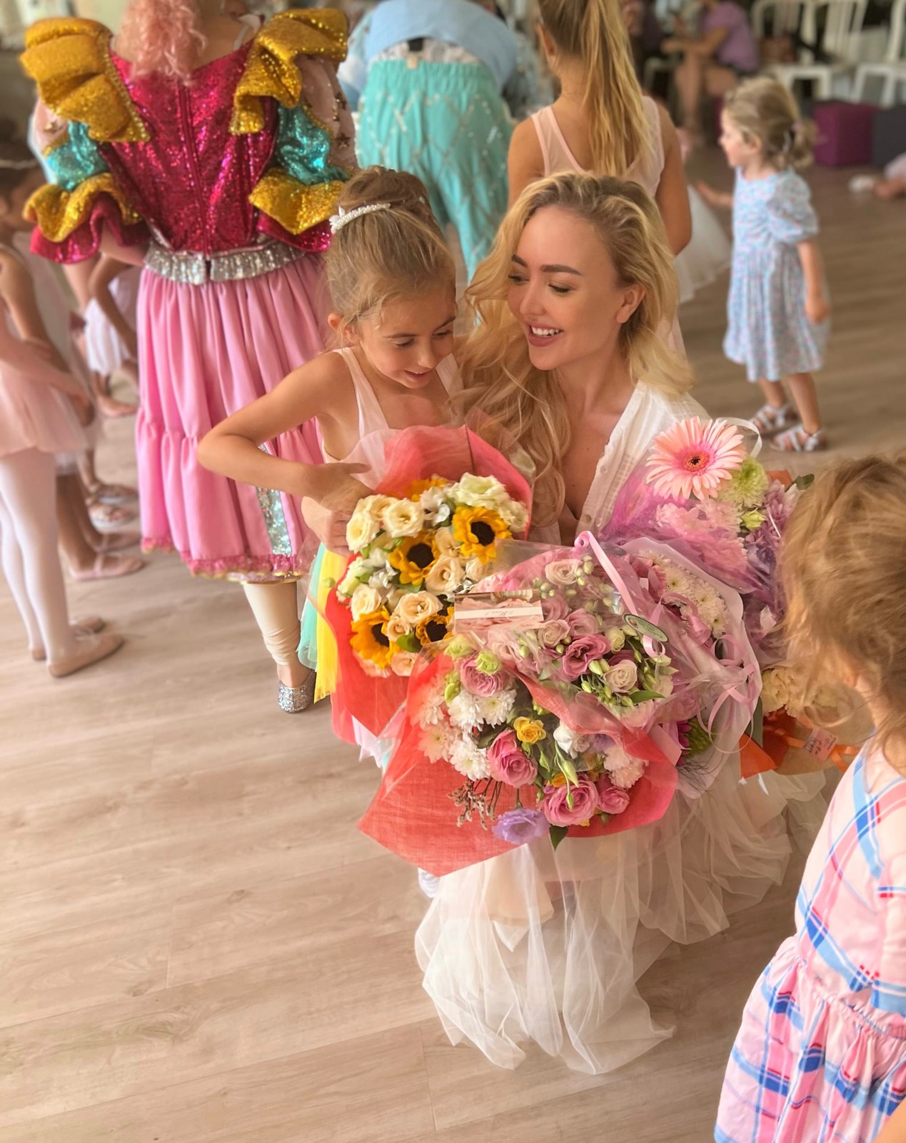 Young dancer handing flowers to Tatiana Samoshkina after a ballet show in Nice