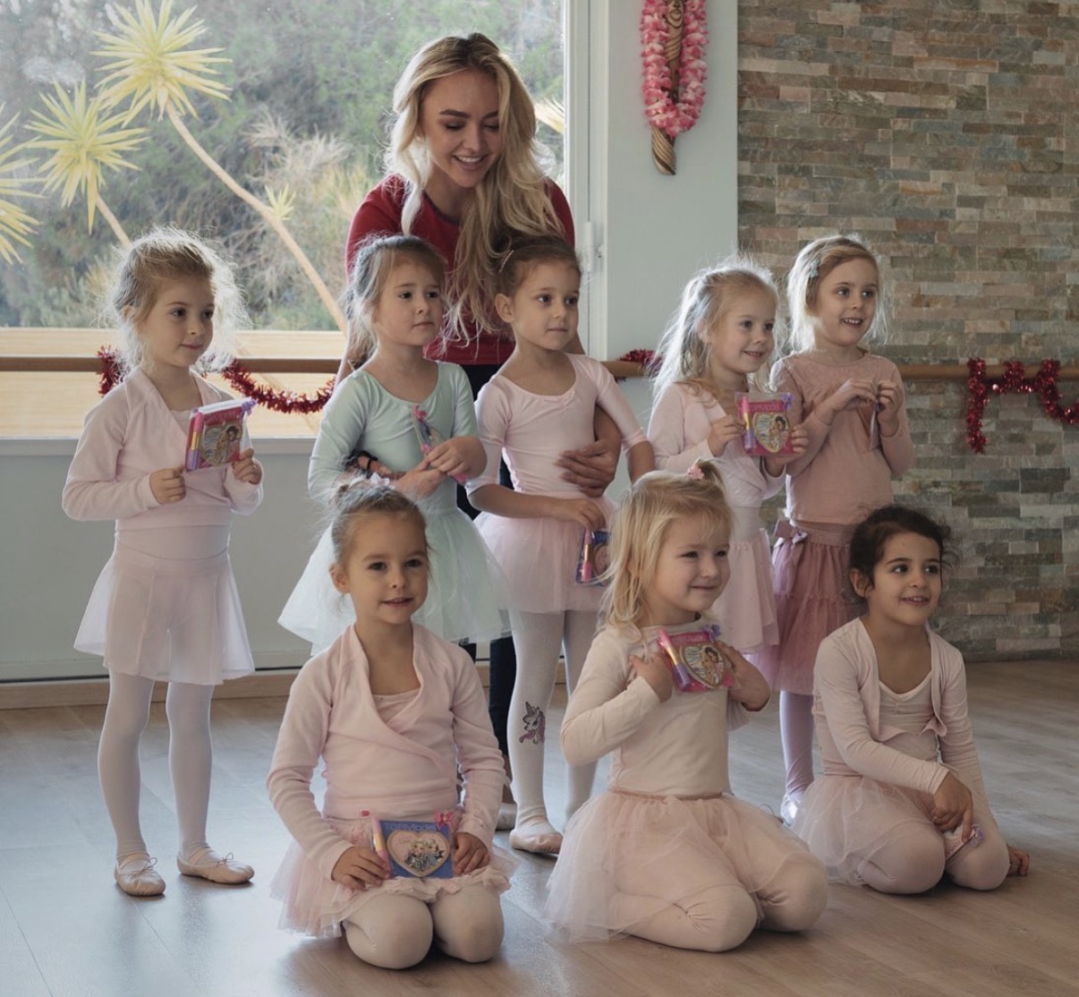 Tatiana Samoshkina with a group of young ballet students in class